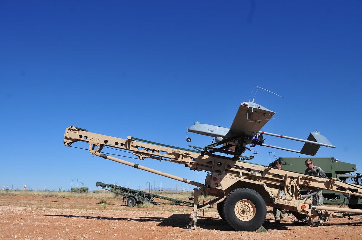 Military uncrewed aircraft launch system deployed at an outdoor test range
